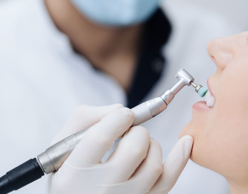 woman getting her teeth polished