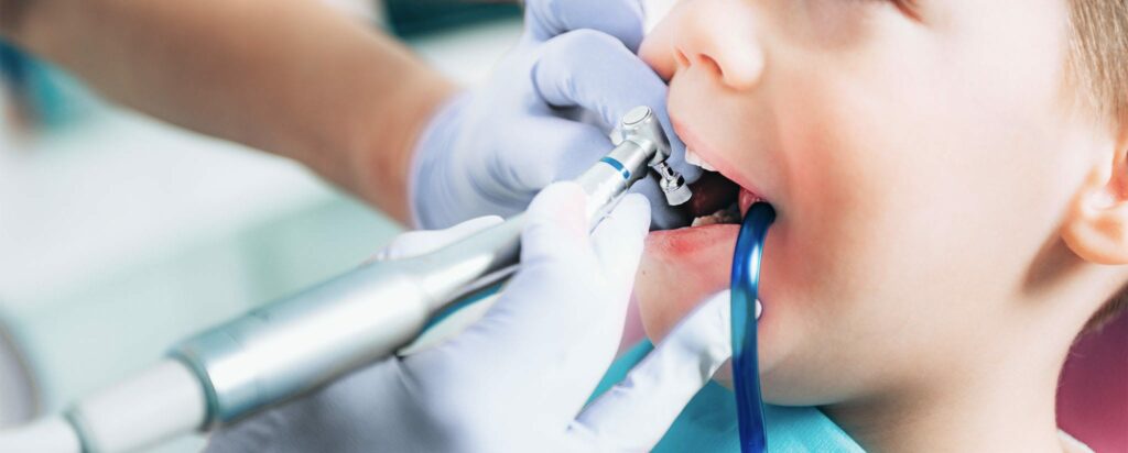 a kid getting his teeth polished