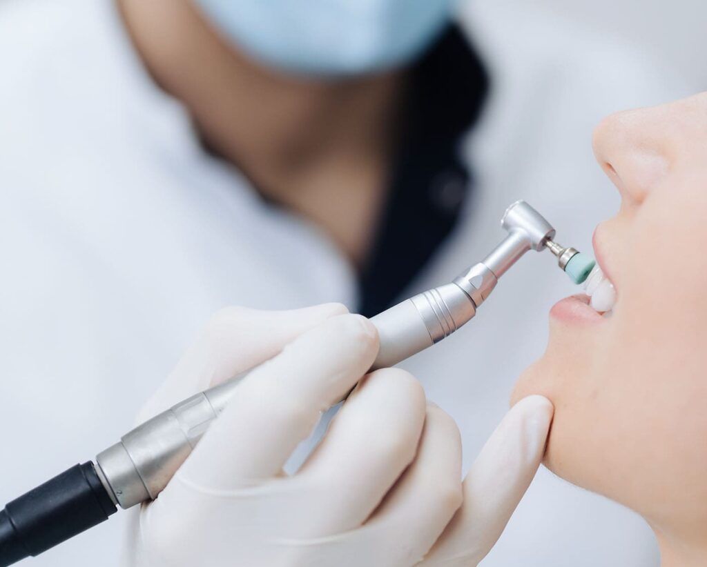 woman getting her teeth polished