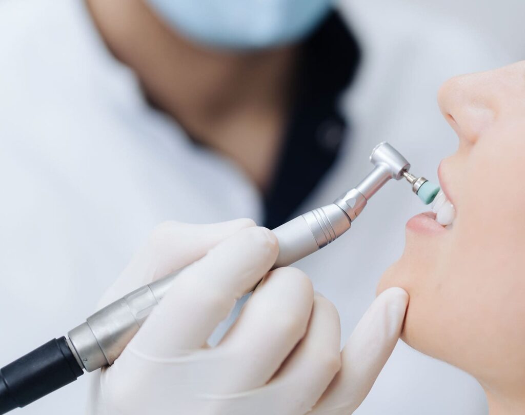 woman getting her teeth polished